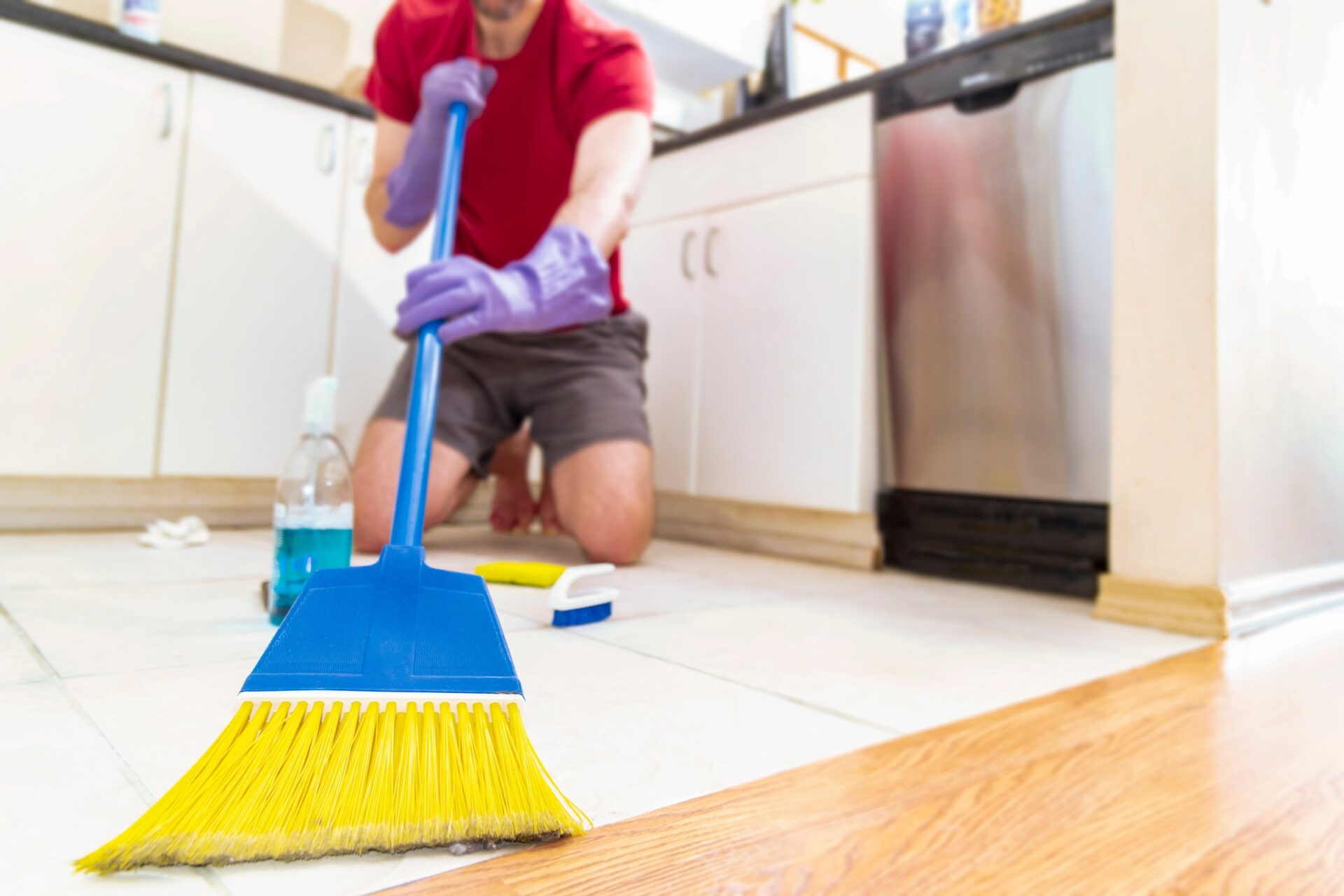 Person cleaning with broom