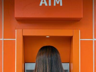 women standing at the ATM