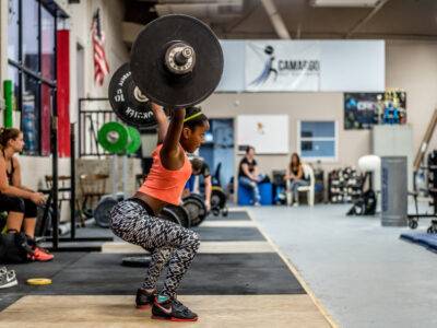 Women powerlifting in the gym